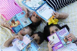 Four children reading books
