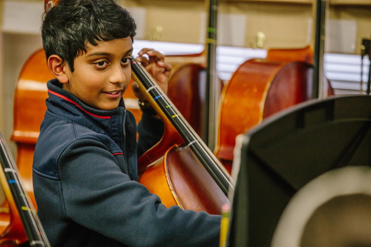 Photo of boy playing cello 