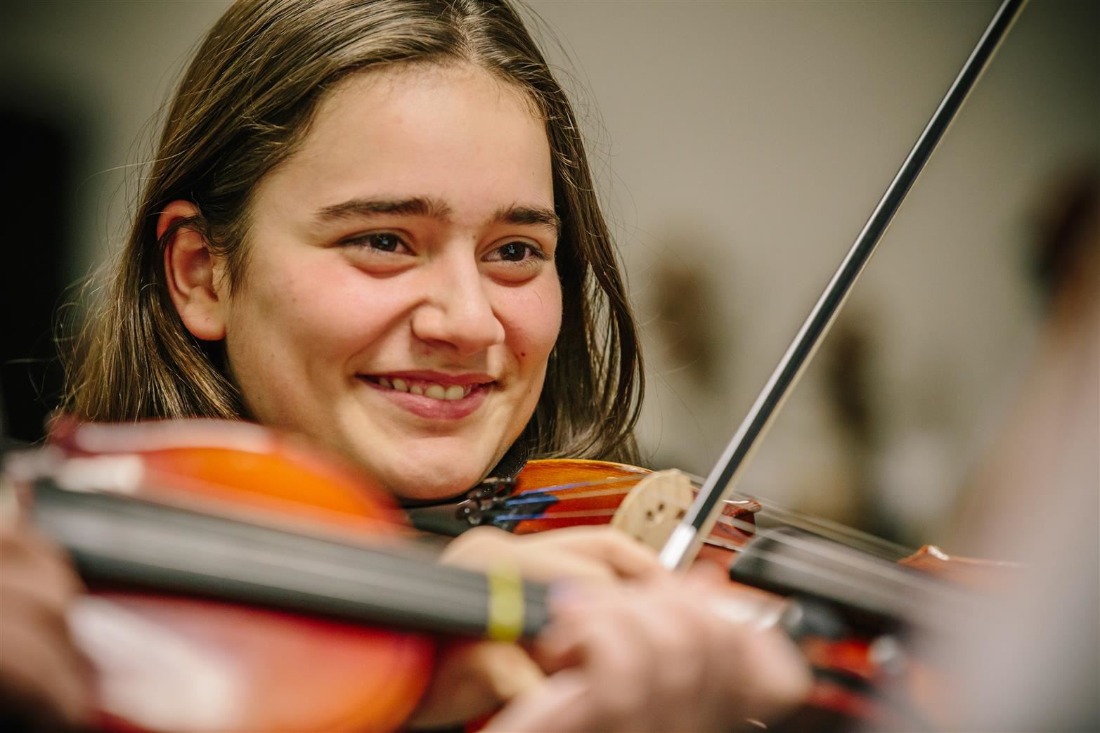 Photo of smiling girl with violin 