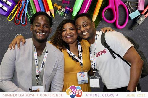 GCPS leaders share a moment during the district's Summer Leadership Conference in June 2022.