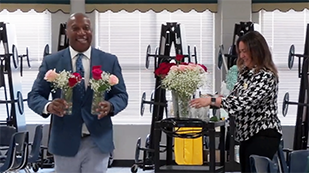  Dr. Watts distributes flowers at Starling Elementary