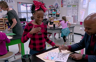  Dr. Watts paints with an art student at Burnette ES