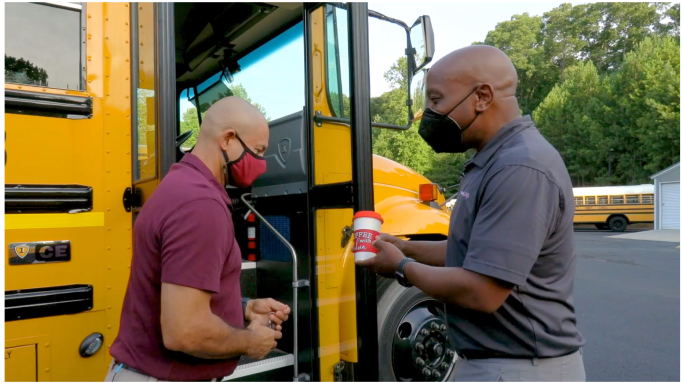  Dr. Watts hands Mr. Rich a cup of coffee