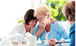 woman consoling another woman 